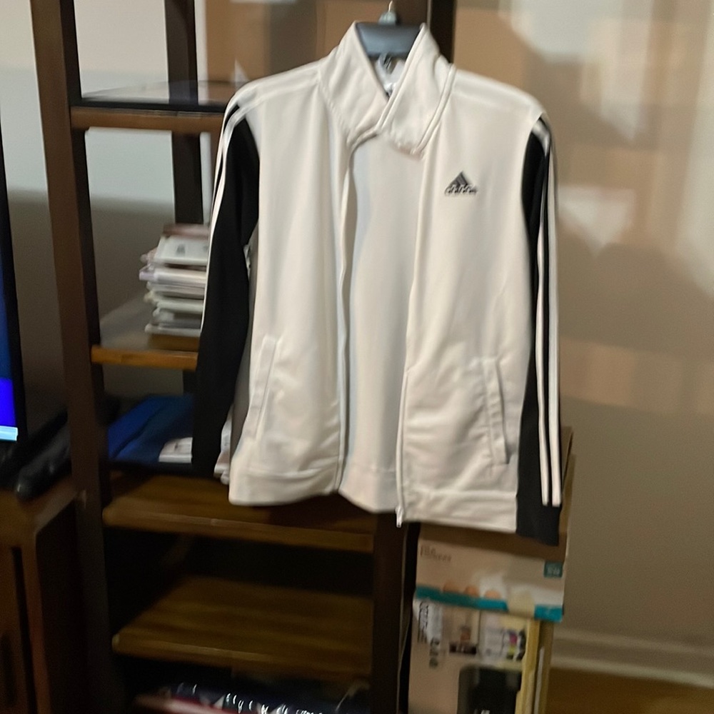 adidas black/white jacket. Zipped front .  Boys and girls size L14 /16.